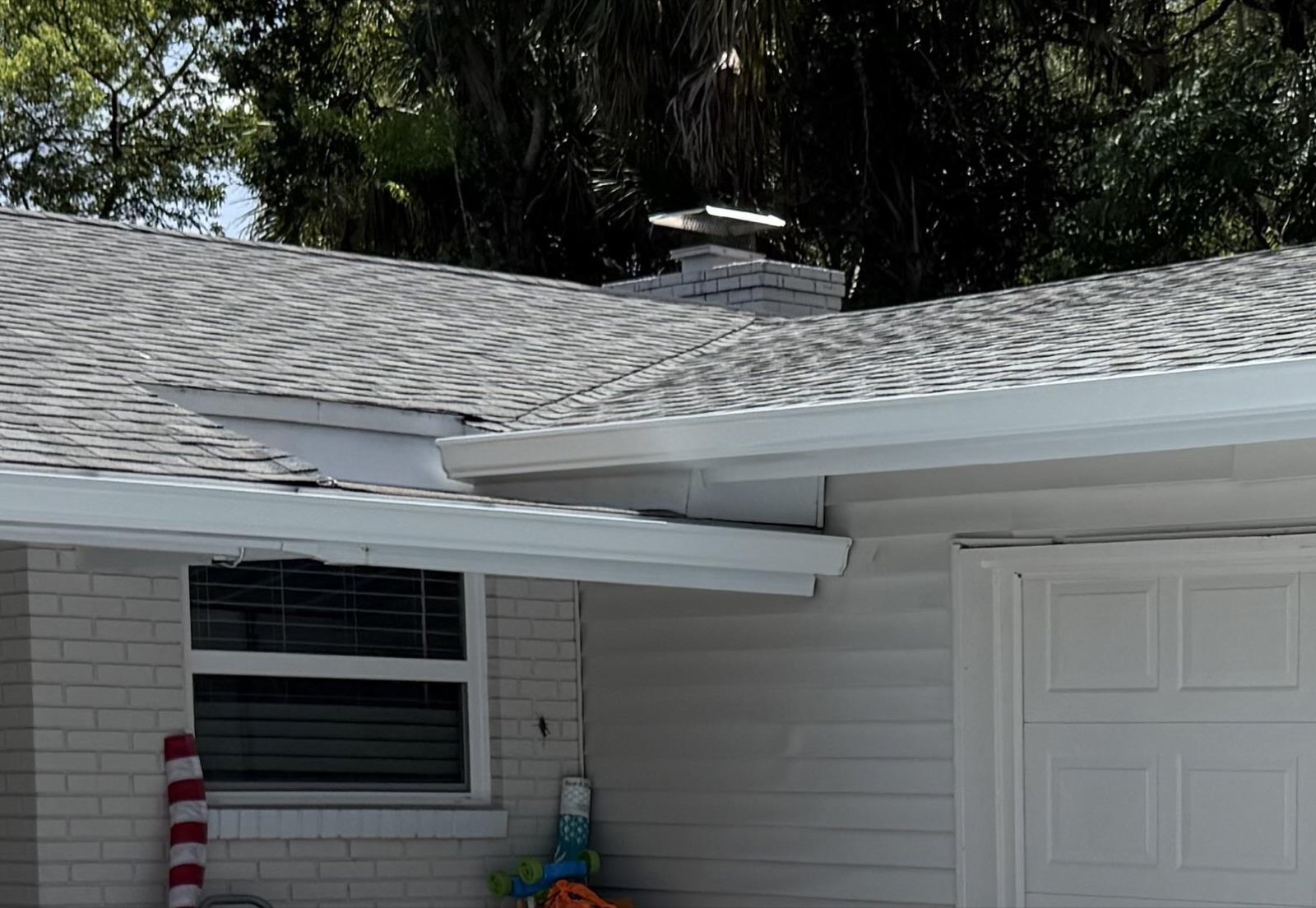 New seamless gutter extended into a roof nook at an Altamonte Springs home